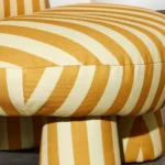 talent design, modern çizgili berjer koltuk, renkli desenli tekli koltuk, minimal tasarım salon koltuğu, yuvarlak hatlı iç mekan koltuğu, çağdaş çizgili döşemeli koltuk, konforlu ve tarz tekli oturum, dekoratif modern koltuk önerisi, genç ve dinamik koltuk stili, şık formda desenli koltuk modeli, renkli iç mekan uyumlu koltuk, kol destekli modern berjer alternatifi, çizgili kumaş döşeme trendi, eğlenceli ve modern çizgi estetiği koltuk